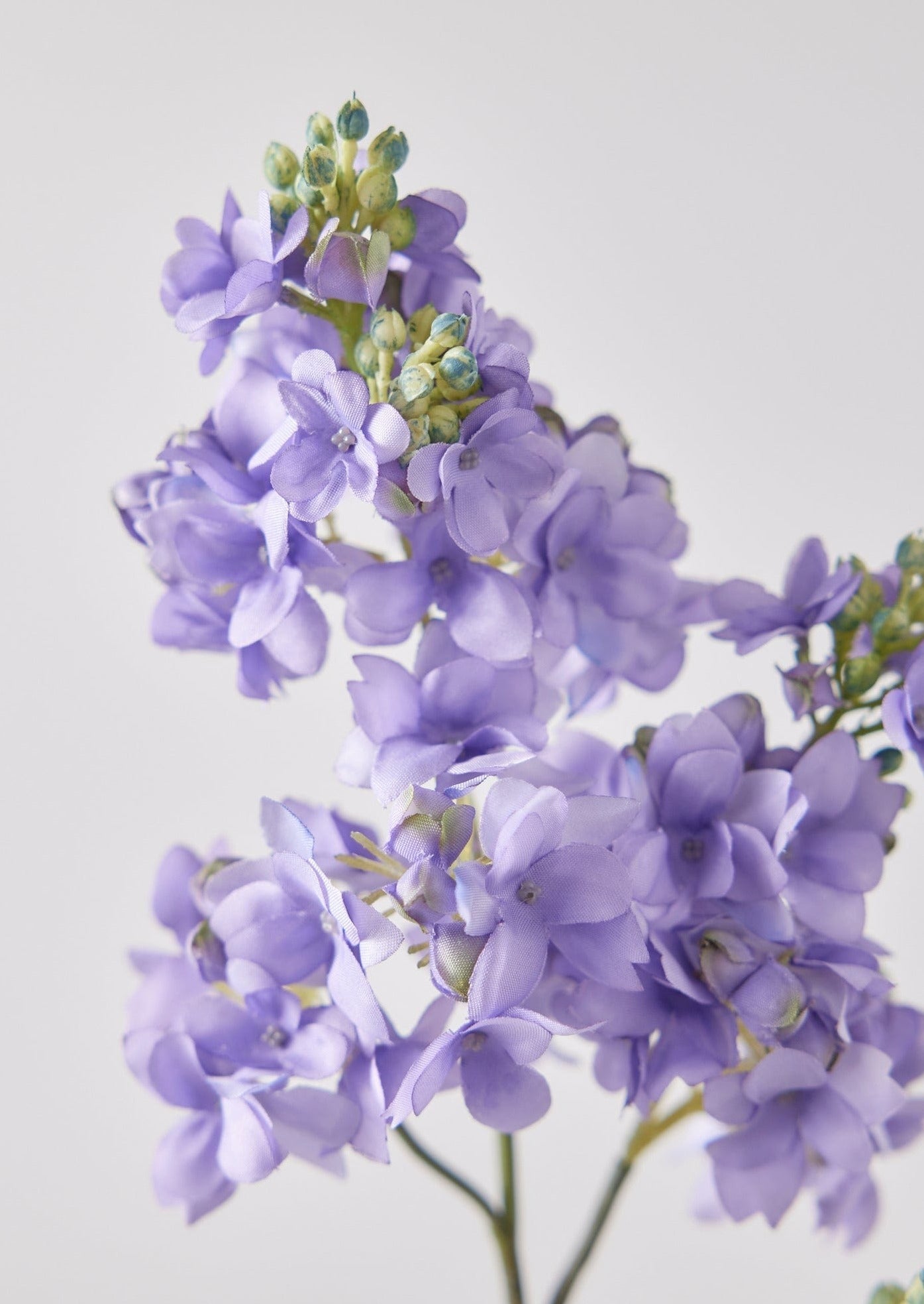 Closeup View of Faux Lilac Flowers in Lavender